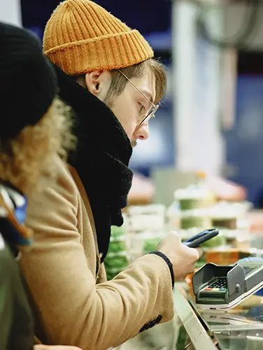 Person holds the smartphone in their hand.