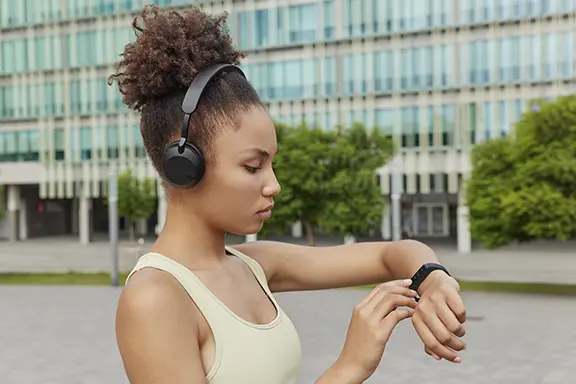 Person wears the fitness tracker on their arm.